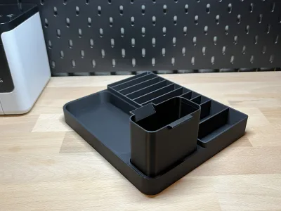 The station at an angle without the printer: the tape bays, the catch tray and the shallow bay