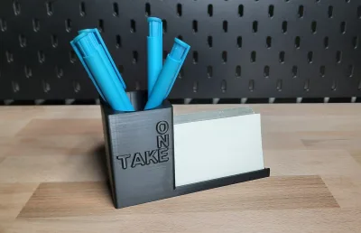The TAKE ONE variant from the side on the wooden surface